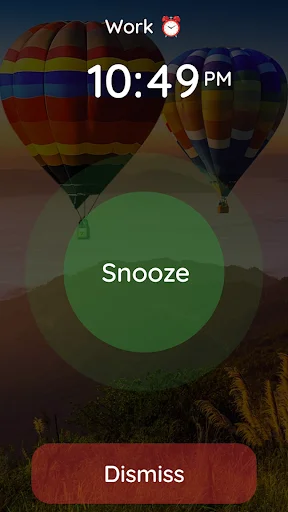 Alarm notification screen with snooze and dismiss buttons over scenic hot air balloon background image